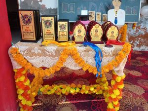 Result Day Celebration at SSN Public School , 1st , 2nd , 3rd prizes sheilds at the table